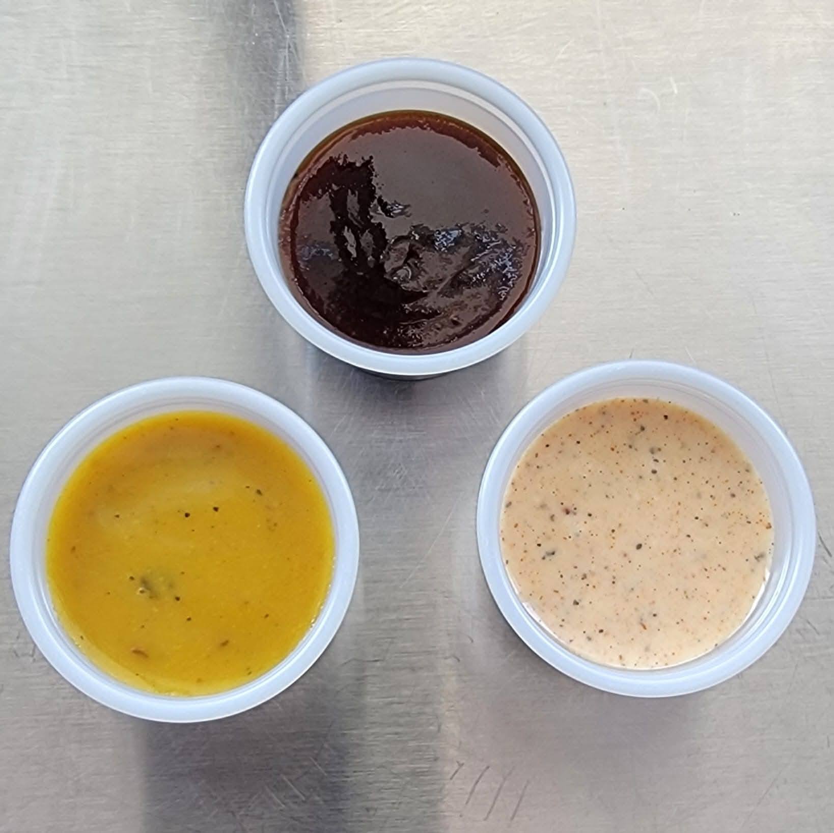 Hoakie Smoakes three house BBQ sauces